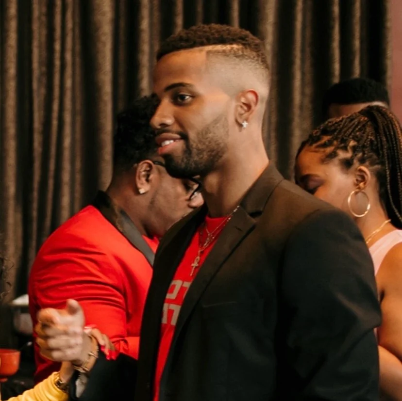 Rody Diyoka in a black blazer at an event